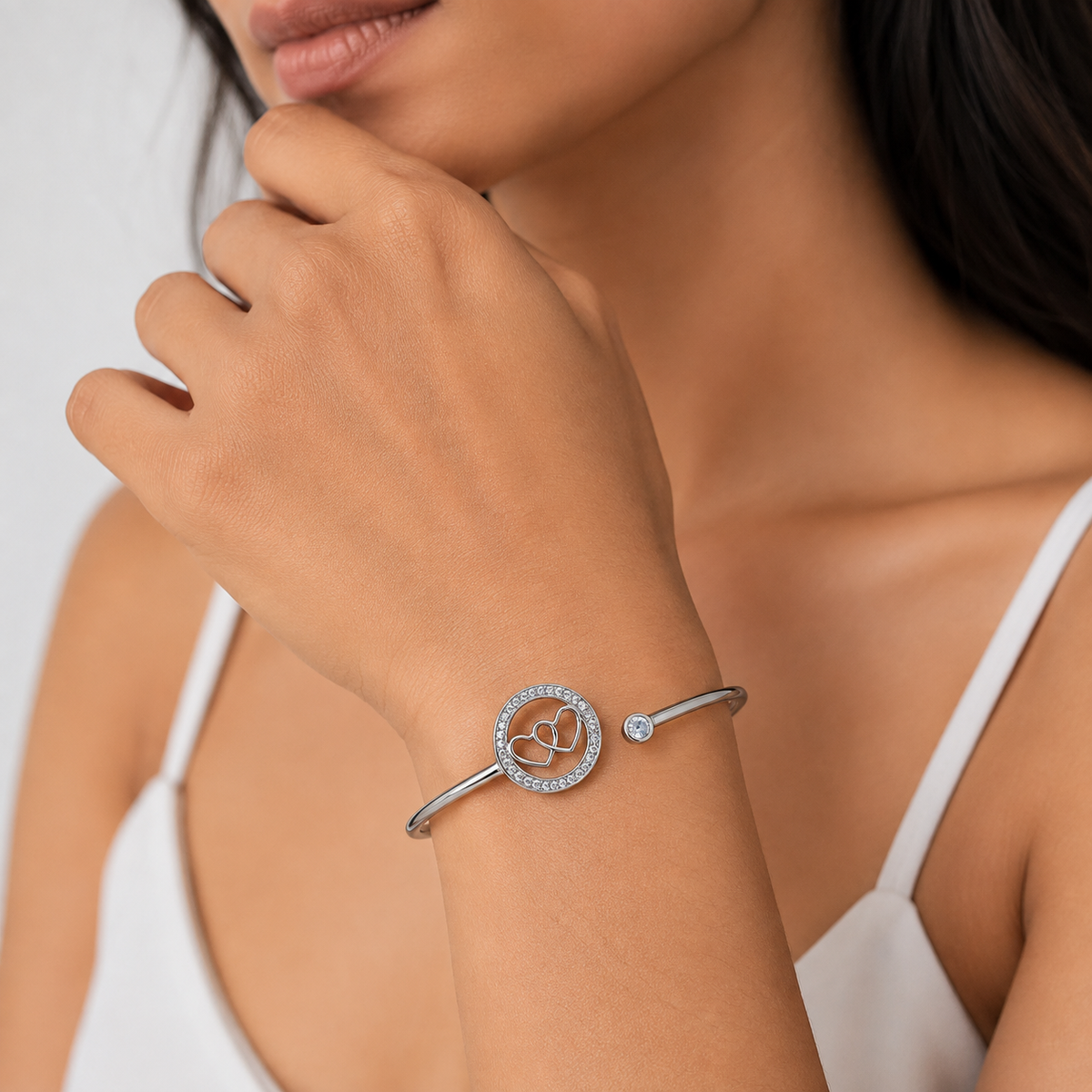 Elegant Interlocking Hearts Bangle