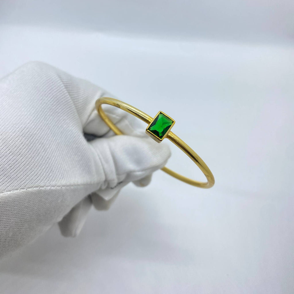 Elegant Portrait with Emerald Bangle